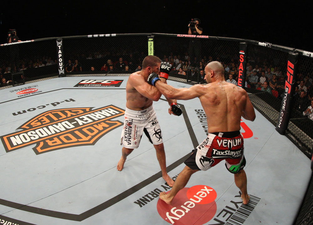 SYDNEY, AUSTRALIA - MARCH 03: (R-L) Constantinos Philippou punches Court McGee in a middleweight bout during the UFC on FX event at Allphones Arena on March 3, 2012 in Sydney, Australia. (Photo by Josh Hedges/Zuffa LLC/Zuffa LLC via Getty Images) *** Local Caption *** Court McGee; Constantinos Philippou
