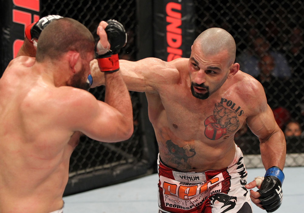 SYDNEY, AUSTRALIA - MARCH 03: (R-L) Constantinos Philippou punches Court McGee in a middleweight bout during the UFC on FX event at Allphones Arena on March 3, 2012 in Sydney, Australia. (Photo by Josh Hedges/Zuffa LLC/Zuffa LLC via Getty Images) *** Local Caption *** Court McGee; Constantinos Philippou