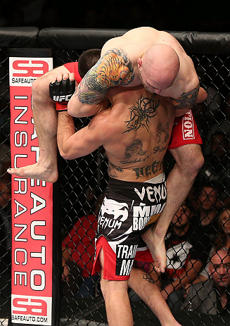 MINNEAPOLIS, MN - OCTOBER 05: (R-L) Justin Edwards secures a guillotine choke submission to defeat Josh Neer during their welterweight fight at the UFC on FX event at Target Center on October 5, 2012 in Minneapolis, Minnesota. (Photo by Josh Hedges/Zuffa LLC/Zuffa LLC via Getty Images)
