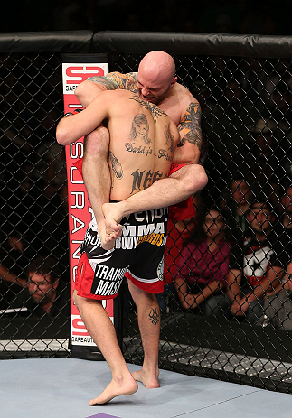MINNEAPOLIS, MN - OCTOBER 05: (R-L) Justin Edwards secures a guillotine choke submission to defeat Josh Neer during their welterweight fight at the UFC on FX event at Target Center on October 5, 2012 in Minneapolis, Minnesota. (Photo by Josh Hedges/Zuffa LLC/Zuffa LLC via Getty Images)
