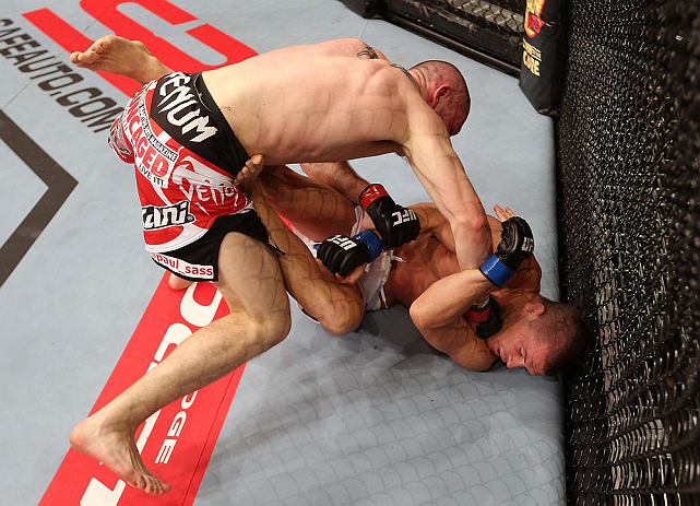 NOTTINGHAM, ENGLAND - SEPTEMBER 29: (L-R) Paul Sass punches Matt Wiman during their lightweight fight at the UFC on Fuel TV event at Capital FM Arena on September 29, 2012 in Nottingham, England. (Photo by Josh Hedges/Zuffa LLC/Zuffa LLC via Getty Images)