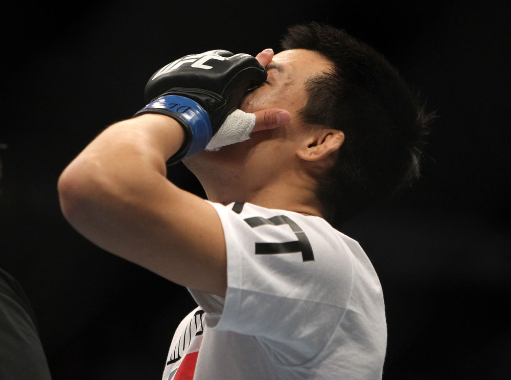 TORONTO, ON - DECEMBER 10:  "The Korean Zombie" Chan Sung Jung reacts after knocking out Mark Hominick during the UFC 140 event at Air Canada Centre on December 10, 2011 in Toronto, Ontario, Canada.  (Photo by Josh Hedges/Zuffa LLC/Zuffa LLC via Getty Images)