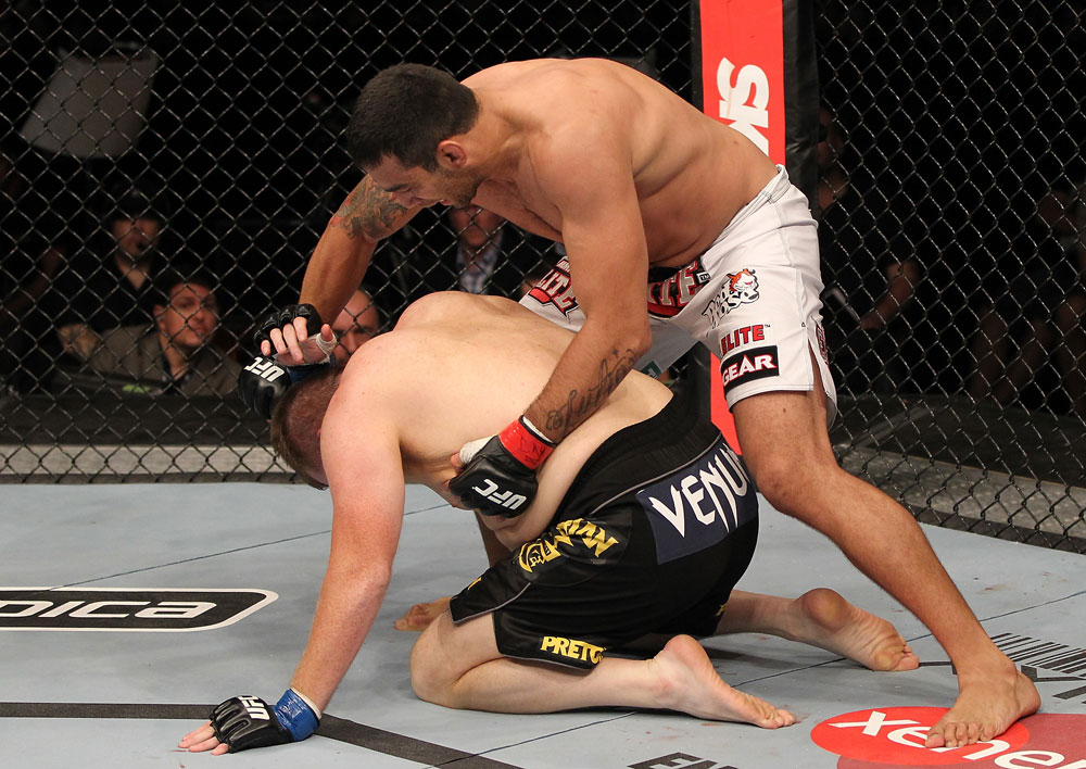 BELO HORIZONTE, BRAZIL - JUNE 23: (R-L) Fabricio Werdum punches Mike Russow during their UFC 147 heavyweight bout at Estadio Jornalista Felipe Drummond on June 23, 2012 in Belo Horizonte, Brazil. (Photo by Josh Hedges/Zuffa LLC/Zuffa LLC via Getty Images)