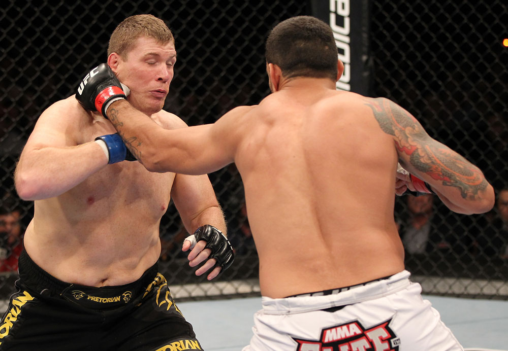 BELO HORIZONTE, BRAZIL - JUNE 23: (R-L) Fabricio Werdum punches Mike Russow during their UFC 147 heavyweight bout at Estadio Jornalista Felipe Drummond on June 23, 2012 in Belo Horizonte, Brazil. (Photo by Josh Hedges/Zuffa LLC/Zuffa LLC via Getty Images)