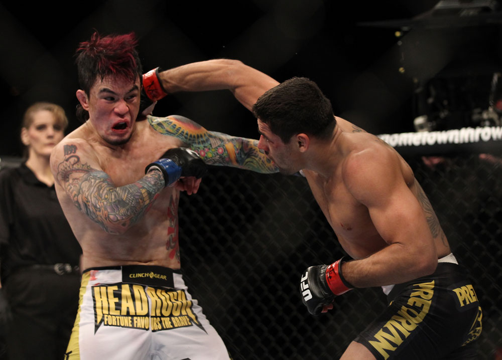LAS VEGAS, NV - FEBRUARY 04:  Renan Barao (right) punches Scott Jorgensen during the UFC 143 event at Mandalay Bay Events Center on February 4, 2012 in Las Vegas, Nevada.  (Photo by Josh Hedges/Zuffa LLC/Zuffa LLC via Getty Images) *** Local Caption *** Renan Barao; Scott Jorgensen