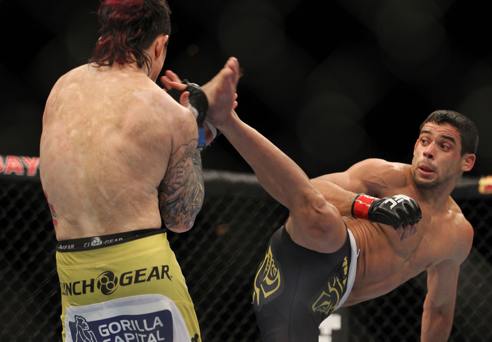 LAS VEGAS, NV - FEBRUARY 04:  Renan Barao (right) attempts to kick Scott Jorgensen during the UFC 143 event at Mandalay Bay Events Center on February 4, 2012 in Las Vegas, Nevada.  (Photo by Josh Hedges/Zuffa LLC/Zuffa LLC via Getty Images) *** Local Caption *** Renan Barao; Scott Jorgensen