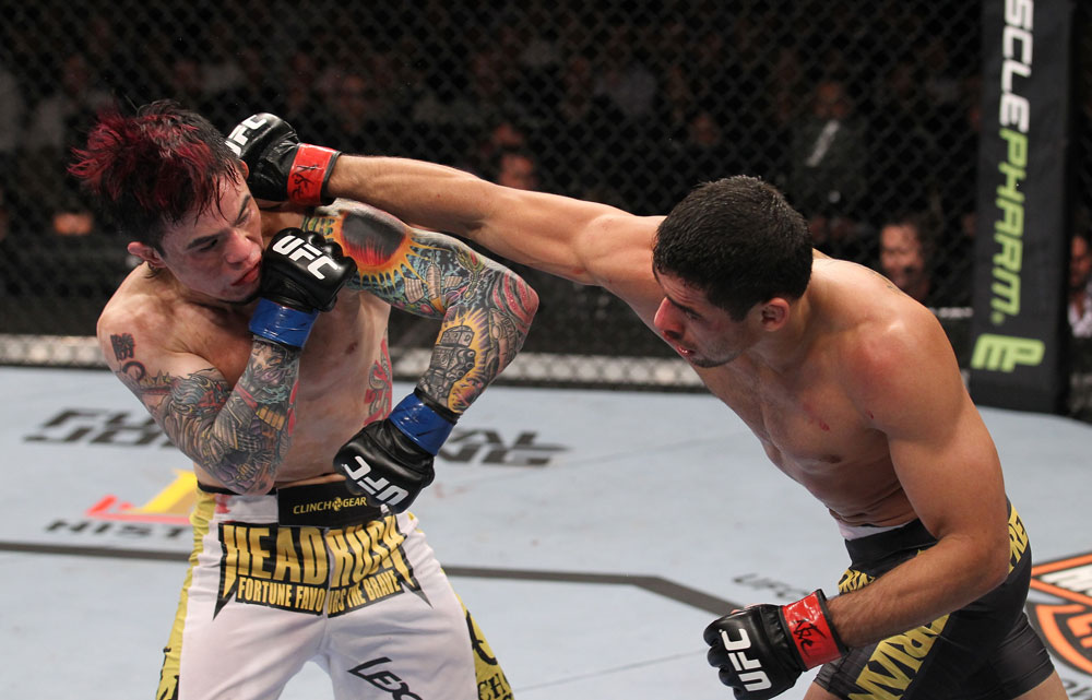 LAS VEGAS, NV - FEBRUARY 04:  Renan Barao (right) punches Scott Jorgensen during the UFC 143 event at Mandalay Bay Events Center on February 4, 2012 in Las Vegas, Nevada.  (Photo by Nick Laham/Zuffa LLC/Zuffa LLC via Getty Images) *** Local Caption *** Renan Barao; Scott Jorgensen