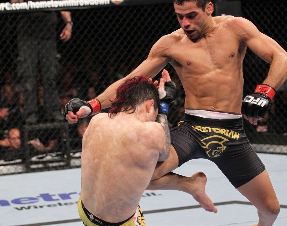 LAS VEGAS, NV - FEBRUARY 04:  Renan Barao (right) knees Scott Jorgensen during the UFC 143 event at Mandalay Bay Events Center on February 4, 2012 in Las Vegas, Nevada.  (Photo by Nick Laham/Zuffa LLC/Zuffa LLC via Getty Images) *** Local Caption *** Renan Barao; Scott Jorgensen