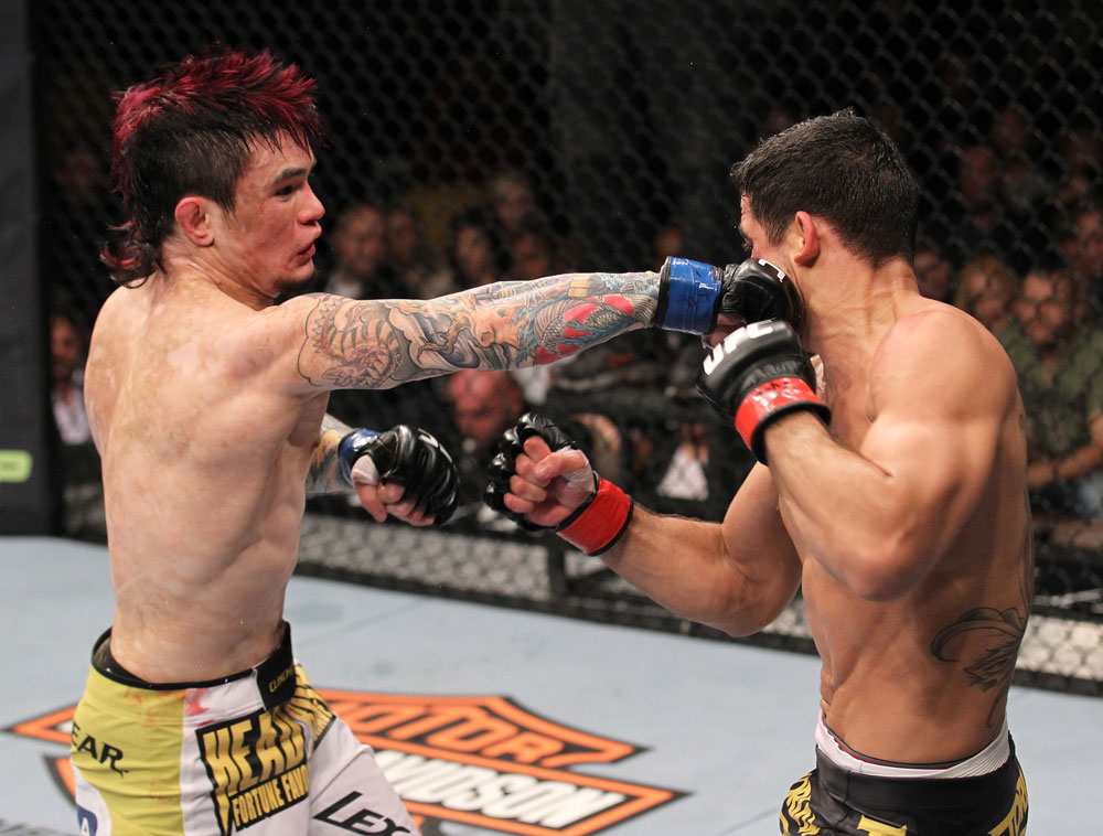 LAS VEGAS, NV - FEBRUARY 04:  Scott Jorgensen (left) punches Renan Barao during the UFC 143 event at Mandalay Bay Events Center on February 4, 2012 in Las Vegas, Nevada.  (Photo by Nick Laham/Zuffa LLC/Zuffa LLC via Getty Images) *** Local Caption *** Scott Jorgensen; Renan Barao