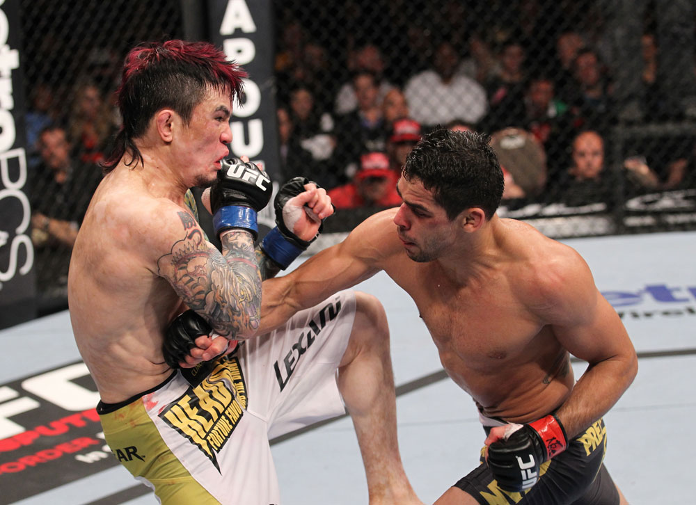 LAS VEGAS, NV - FEBRUARY 04:  Renan Barao (right) punches Scott Jorgensen during the UFC 143 event at Mandalay Bay Events Center on February 4, 2012 in Las Vegas, Nevada.  (Photo by Nick Laham/Zuffa LLC/Zuffa LLC via Getty Images) *** Local Caption *** Renan Barao; Scott Jorgensen