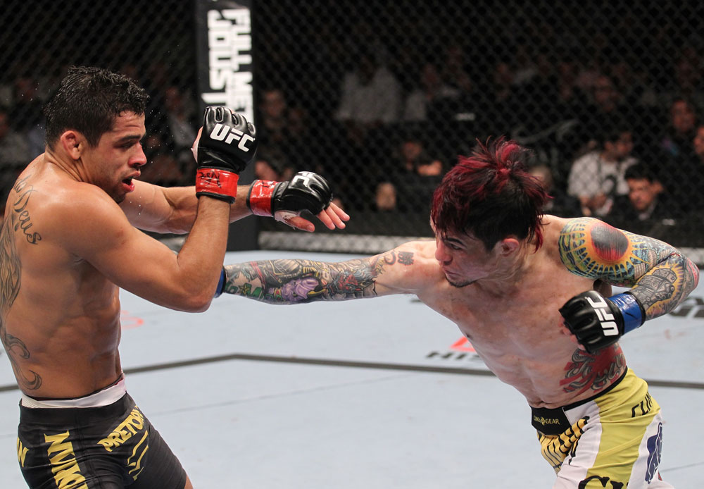 LAS VEGAS, NV - FEBRUARY 04:  Scott Jorgensen (right) punches Renan Barao during the UFC 143 event at Mandalay Bay Events Center on February 4, 2012 in Las Vegas, Nevada.  (Photo by Nick Laham/Zuffa LLC/Zuffa LLC via Getty Images) *** Local Caption *** Scott Jorgensen; Renan Barao