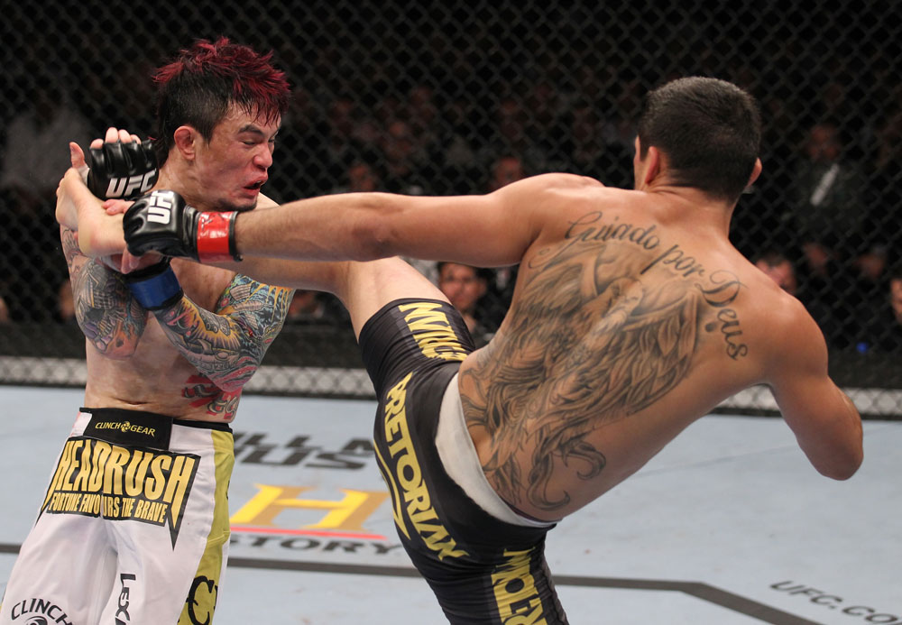 LAS VEGAS, NV - FEBRUARY 04:  Renan Barao (right) kicks Scott Jorgensen during the UFC 143 event at Mandalay Bay Events Center on February 4, 2012 in Las Vegas, Nevada.  (Photo by Nick Laham/Zuffa LLC/Zuffa LLC via Getty Images) *** Local Caption *** Renan Barao; Scott Jorgensen