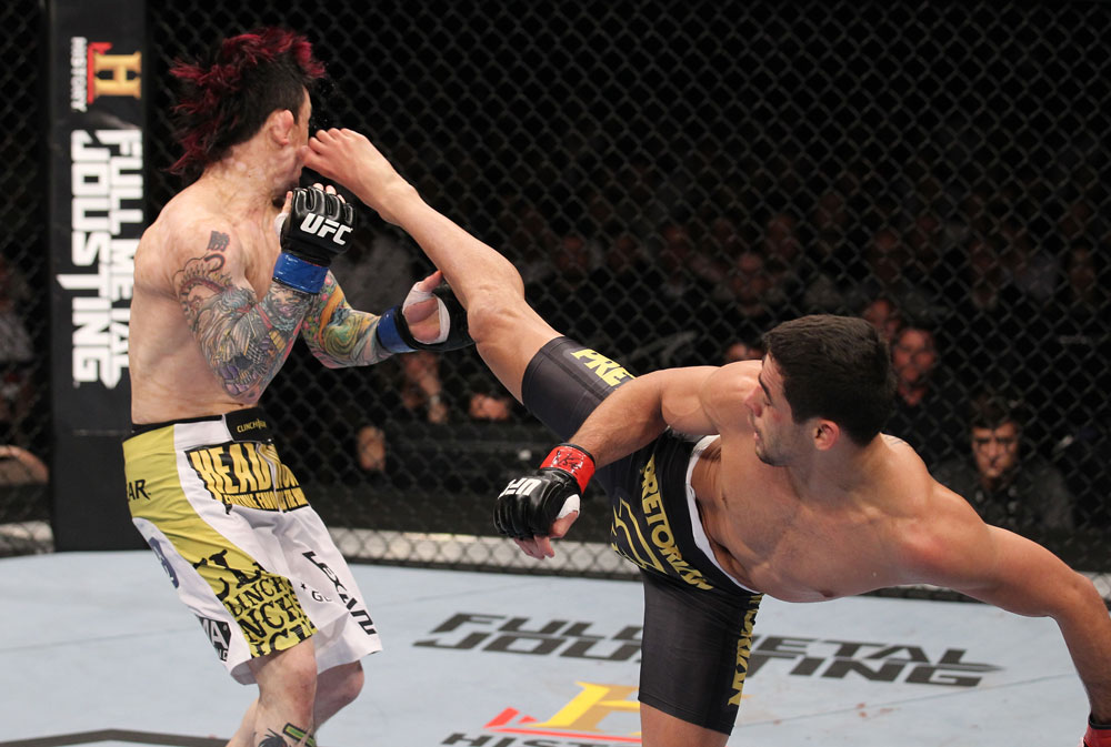 LAS VEGAS, NV - FEBRUARY 04:  Renan Barao (right) kicks Scott Jorgensen during the UFC 143 event at Mandalay Bay Events Center on February 4, 2012 in Las Vegas, Nevada.  (Photo by Nick Laham/Zuffa LLC/Zuffa LLC via Getty Images) *** Local Caption *** Renan Barao; Scott Jorgensen