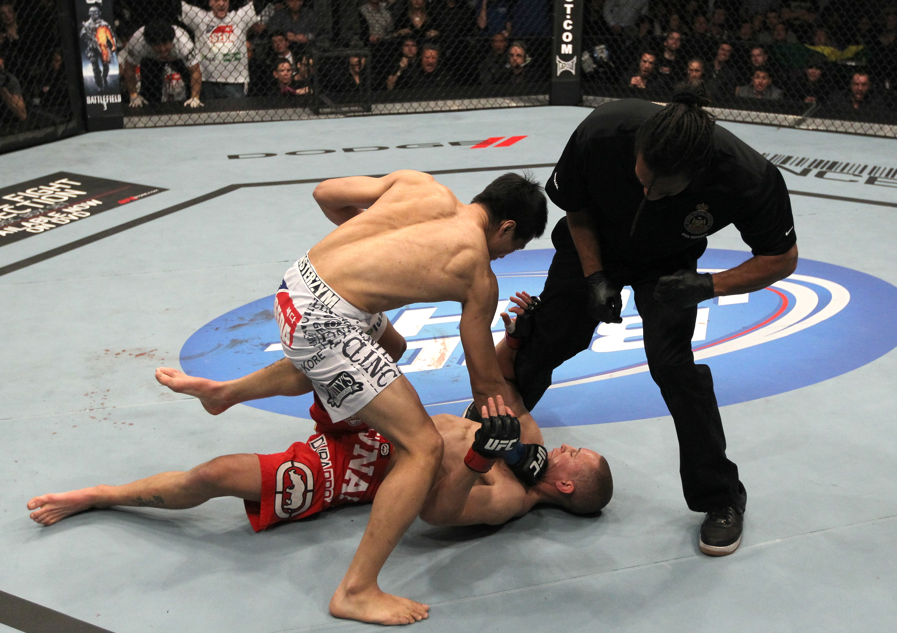TORONTO, ON - DECEMBER 10:  (L-R) "The Korean Zombie" Chan Sung Jung defeats Mark Hominick by knockout during the UFC 140 event at Air Canada Centre on December 10, 2011 in Toronto, Ontario, Canada.  (Photo by Nick Laham/Zuffa LLC/Zuffa LLC via Getty Images)