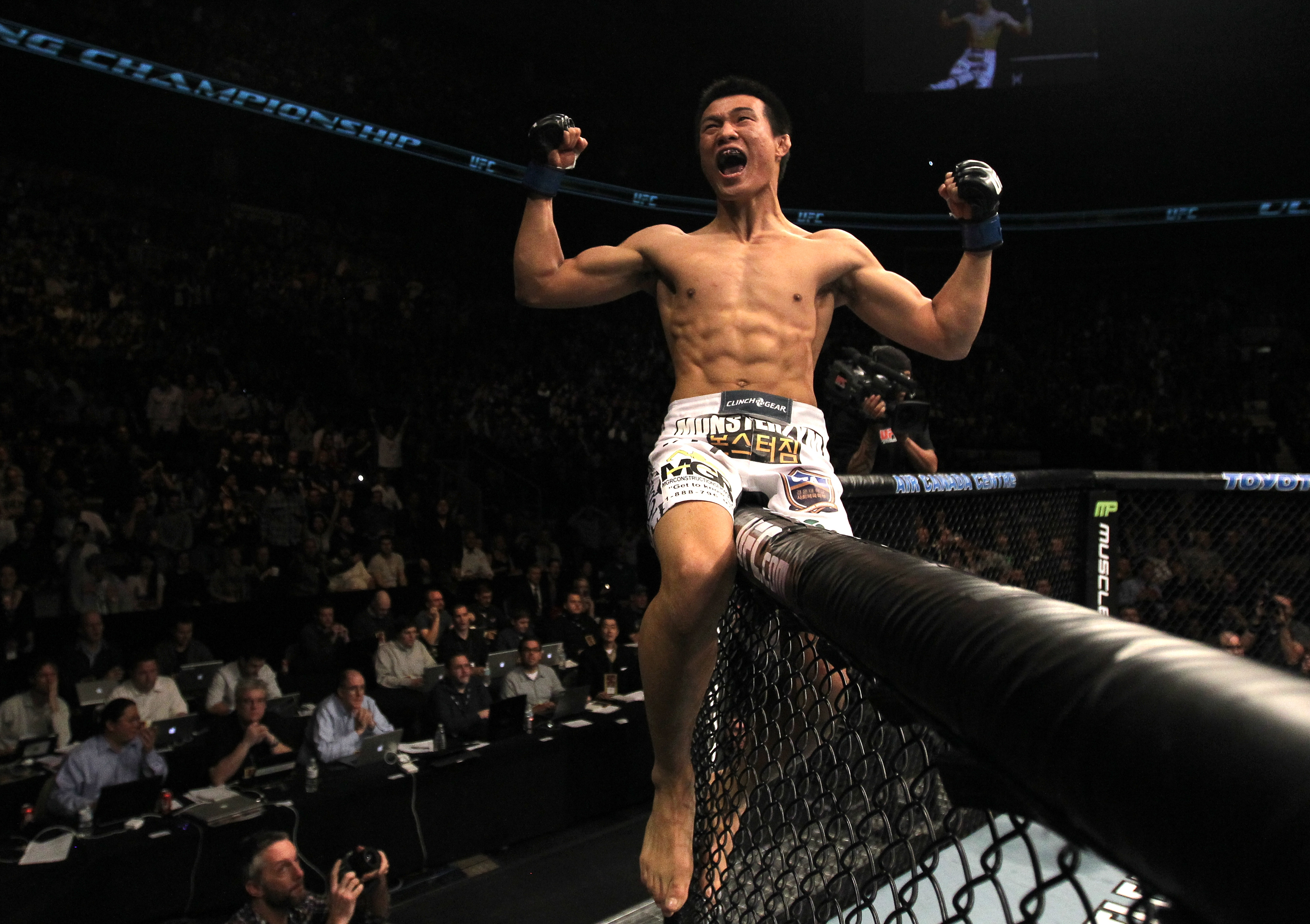 TORONTO, ON - DECEMBER 10:  "The Korean Zombie" Chan Sung Jung reacts after knocking out Mark Hominick during the UFC 140 event at Air Canada Centre on December 10, 2011 in Toronto, Ontario, Canada.  (Photo by Nick Laham/Zuffa LLC/Zuffa LLC via Getty Images)