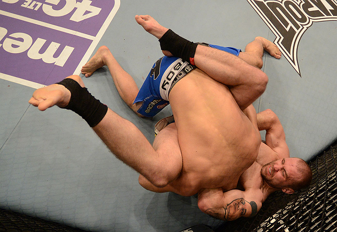 LAS VEGAS, NV - DECEMBER 29:  Alan Belcher (pictured) attempts to submit Yushin Okami during their middleweight fight at UFC 155 on December 29, 2012 at MGM Grand Garden Arena in Las Vegas, Nevada. (Photo by Donald Miralle/Zuffa LLC/Zuffa LLC via Getty Images) *** Local Caption *** Yushin Okami; Alan Belcher