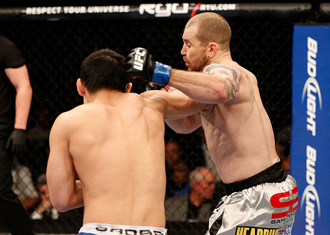 LAS VEGAS, NV - DECEMBER 29:  (L-R) Yushin Okami punches Alan Belcher during their middleweight fight at UFC 155 on December 29, 2012 at MGM Grand Garden Arena in Las Vegas, Nevada. (Photo by Josh Hedges/Zuffa LLC/Zuffa LLC via Getty Images) *** Local Caption *** Yushin Okami; Alan Belcher