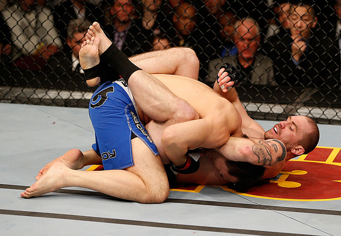 LAS VEGAS, NV - DECEMBER 29:  Alan Belcher (right) attempts to submit Yushin Okami during their middleweight fight at UFC 155 on December 29, 2012 at MGM Grand Garden Arena in Las Vegas, Nevada. (Photo by Josh Hedges/Zuffa LLC/Zuffa LLC via Getty Images) *** Local Caption *** Yushin Okami; Alan Belcher