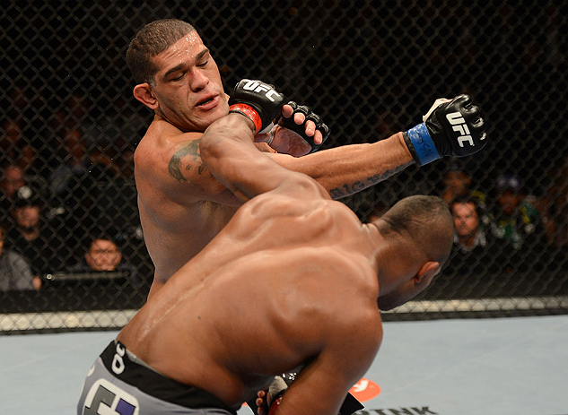 LAS VEGAS, NV - FEBRUARY 02: Antonio Silva (top) punches Alistair Overeem during their heavyweight fight at UFC 156 on February 2, 2013 at the Mandalay Bay Events Center in Las Vegas, Nevada. (Photo by Donald Miralle/Zuffa LLC/Zuffa LLC via Getty Images) *** Local Caption *** Alistair Overeem; Antonio Silva