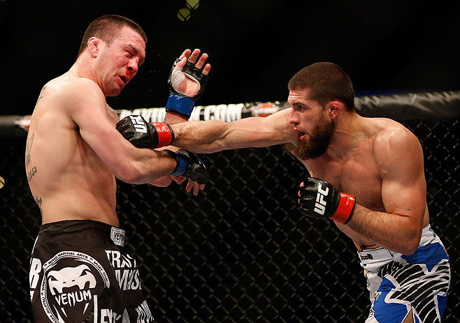 ANAHEIM, CA - FEBRUARY 23: (R-L) Court McGee punches Josh Neer in their welterweight bout during UFC 157 at Honda Center on February 23, 2013 in Anaheim, California. (Photo by Josh Hedges/Zuffa LLC/Zuffa LLC via Getty Images) *** Local Caption *** Court McGee; Josh Neer