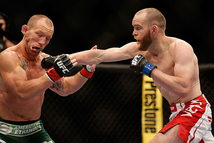 LAS VEGAS, NV - MAY 25:   (R-L) T.J. Grant punches Gray Maynard in their lightweight bout during UFC 160 at the MGM Grand Garden Arena on May 25, 2013 in Las Vegas, Nevada.  (Photo by Josh Hedges/Zuffa LLC/Zuffa LLC via Getty Images)  *** Local Caption *** Gray Maynard; T.J. Grant