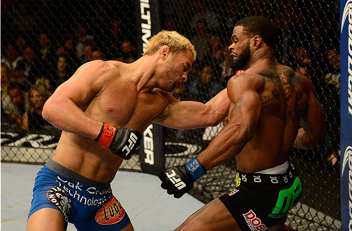 LAS VEGAS, NV - NOVEMBER 16:  (R-L) Tyron Woodley punches Josh Koscheck in their welterweight bout during the UFC 167 event inside the MGM Grand Garden Arena on November 16, 2013 in Las Vegas, Nevada. (Photo by Donald Miralle/Zuffa LLC/Zuffa LLC via Getty Images) *** Local Caption *** Josh Koscheck; Tyron Woodley