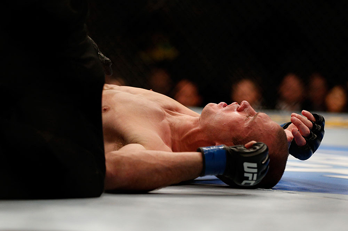 CHICAGO, IL - JANUARY 26:  Donald Cerrone lays on the ground after losing to Anthony Pettis during their Lightweight Bout part of UFC on FOX at United Center on January 26, 2013 in Chicago, Illinois.  (Photo by Josh Hedges/Zuffa LLC/Zuffa LLC Via Getty Images)
