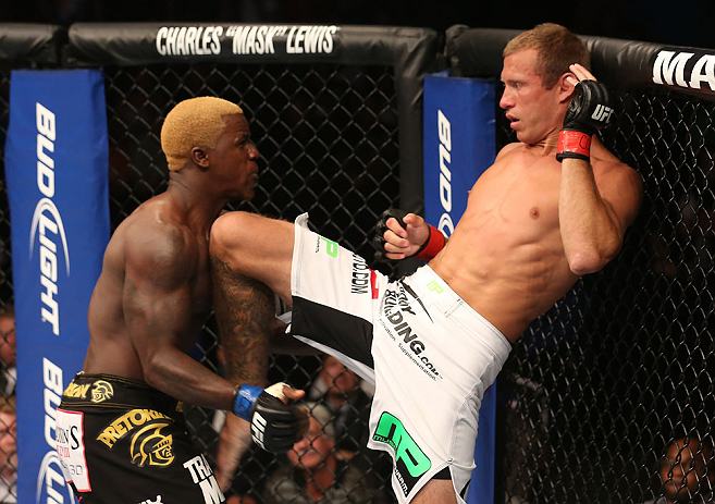 DENVER, CO - AUGUST 11: (R-L) Donald "Cowboy" Cerrone delivers a knee strike against Melvin Guillard during their lightweight bout at UFC 150 inside Pepsi Center on August 11, 2012 in Denver, Colorado. (Photo by Nick Laham/Zuffa LLC/Zuffa LLC via Getty Images)