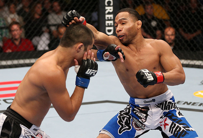 Dodson punches Formiga during their fight at the UFC on 10/5/12 in Minneapolis, MN. (Photo by Josh Hedges/Zuffa LLC)