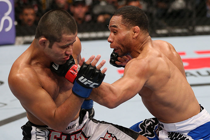 MINNEAPOLIS, MN - OCTOBER 05: (R-L) John Dodson punches Jussier Formiga during their flyweight fight at the UFC on FX event at Target Center on October 5, 2012 in Minneapolis, Minnesota. (Photo by Josh Hedges/Zuffa LLC/Zuffa LLC via Getty Images)