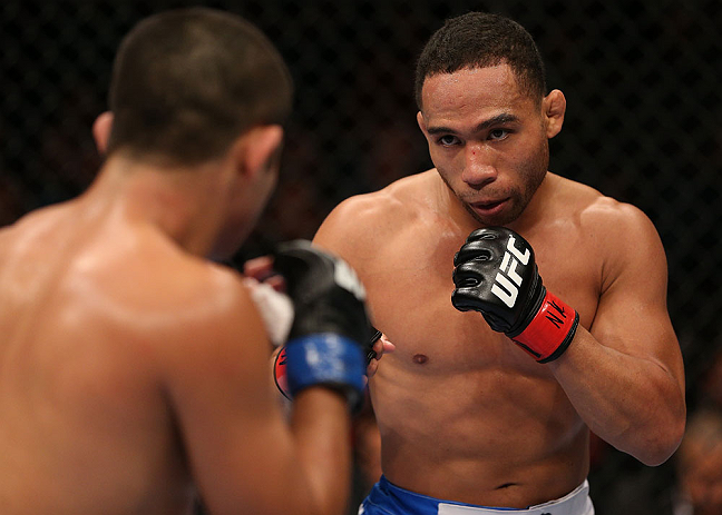 MINNEAPOLIS, MN - OCTOBER 05: (R-L) John Dodson squares off with Jussier Formiga during their flyweight fight at the UFC on FX event at Target Center on October 5, 2012 in Minneapolis, Minnesota. (Photo by Josh Hedges/Zuffa LLC/Zuffa LLC via Getty Images)