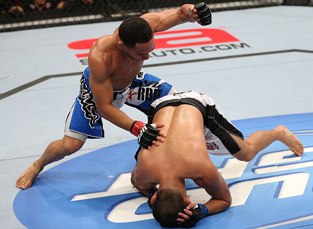 MINNEAPOLIS, MN - OCTOBER 05: (L-R) John Dodson punches Jussier Formiga during their flyweight fight at the UFC on FX event at Target Center on October 5, 2012 in Minneapolis, Minnesota. (Photo by Josh Hedges/Zuffa LLC/Zuffa LLC via Getty Images)