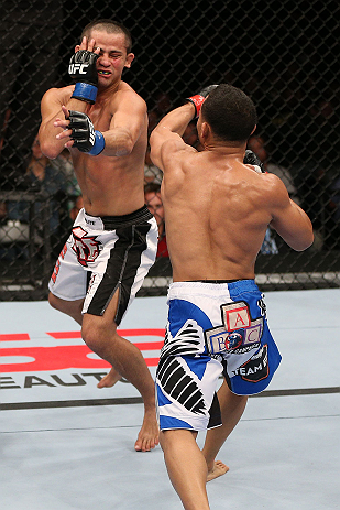 MINNEAPOLIS, MN - OCTOBER 05: (R-L) John Dodson punches Jussier Formiga during their flyweight fight at the UFC on FX event at Target Center on October 5, 2012 in Minneapolis, Minnesota. (Photo by Josh Hedges/Zuffa LLC/Zuffa LLC via Getty Images)