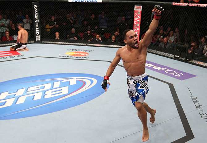 MINNEAPOLIS, MN - OCTOBER 05: John Dodson reacts after knocking out Jussier Formiga during their flyweight fight at the UFC on FX event at Target Center on October 5, 2012 in Minneapolis, Minnesota. (Photo by Josh Hedges/Zuffa LLC/Zuffa LLC via Getty Images)