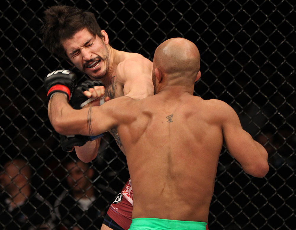SYDNEY, AUSTRALIA - MARCH 03: (R-L) Demetrious Johnson punches Ian McCall in a flyweight bout during the UFC on FX event at Allphones Arena on March 3, 2012 in Sydney, Australia. (Photo by Josh Hedges/Zuffa LLC/Zuffa LLC via Getty Images) *** Local Caption *** Demetrious Johnson; Ian McCall