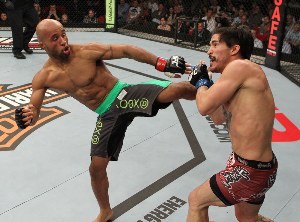 SYDNEY, AUSTRALIA - MARCH 03: (L-R) Demetrious Johnson kicks Ian McCall in a flyweight bout during the UFC on FX event at Allphones Arena on March 3, 2012 in Sydney, Australia. (Photo by Josh Hedges/Zuffa LLC/Zuffa LLC via Getty Images) *** Local Caption *** Demetrious Johnson; Ian McCall
