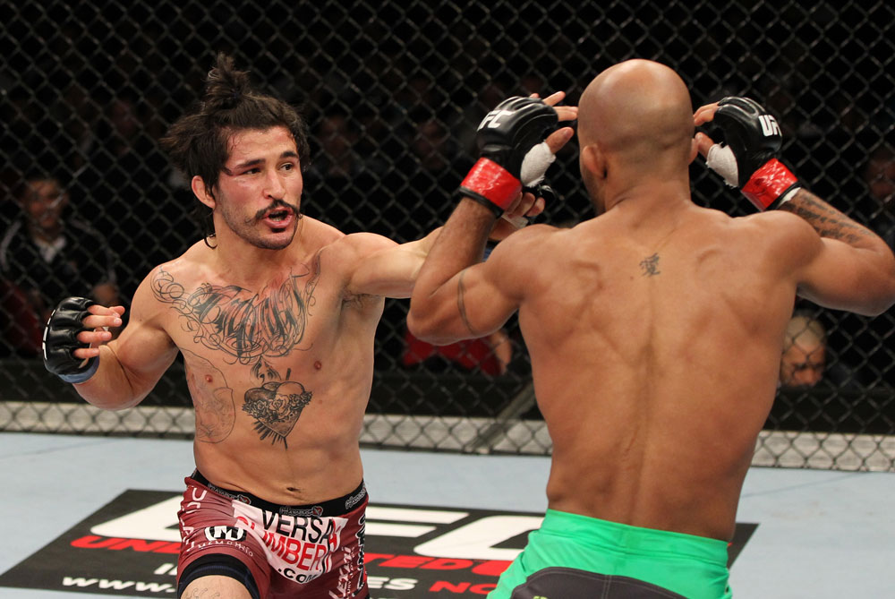 SYDNEY, AUSTRALIA - MARCH 03: (L-R) Ian McCall punches Demetrious Johnson in a flyweight bout during the UFC on FX event at Allphones Arena on March 3, 2012 in Sydney, Australia. (Photo by Josh Hedges/Zuffa LLC/Zuffa LLC via Getty Images) *** Local Caption *** Demetrious Johnson; Ian McCall