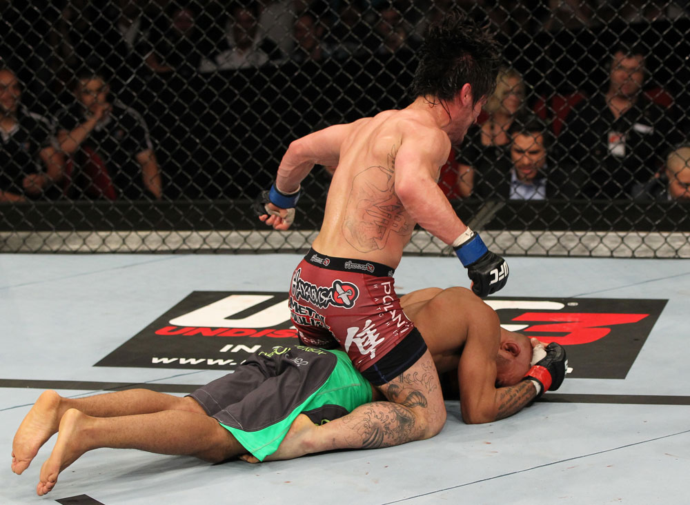 SYDNEY, AUSTRALIA - MARCH 03: Ian McCall punches down at Demetrious Johnson in a flyweight bout during the UFC on FX event at Allphones Arena on March 3, 2012 in Sydney, Australia. (Photo by Josh Hedges/Zuffa LLC/Zuffa LLC via Getty Images) *** Local Caption *** Demetrious Johnson; Ian McCall