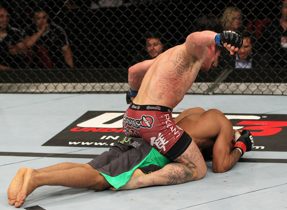 SYDNEY, AUSTRALIA - MARCH 03: Ian McCall punches down at Demetrious Johnson in a flyweight bout during the UFC on FX event at Allphones Arena on March 3, 2012 in Sydney, Australia. (Photo by Josh Hedges/Zuffa LLC/Zuffa LLC via Getty Images) *** Local Caption *** Demetrious Johnson; Ian McCall
