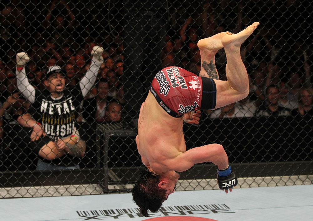 SYDNEY, AUSTRALIA - MARCH 03: Ian McCall performs a back flip in the Octagon after his three-round war against Demetrious Johnson in a flyweight bout during the UFC on FX event at Allphones Arena on March 3, 2012 in Sydney, Australia. (Photo by Josh Hedges/Zuffa LLC/Zuffa LLC via Getty Images) *** Local Caption *** Ian McCall
