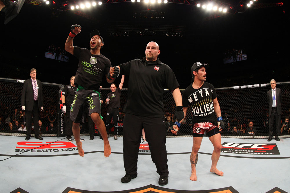 SYDNEY, AUSTRALIA - MARCH 03: Demetrious Johnson (L) reacts after winning a decision over Ian McCall (R) in a flyweight bout during the UFC on FX event at Allphones Arena on March 3, 2012 in Sydney, Australia. (Photo by Josh Hedges/Zuffa LLC/Zuffa LLC via Getty Images) *** Local Caption *** Demetrious Johnson; Ian McCall