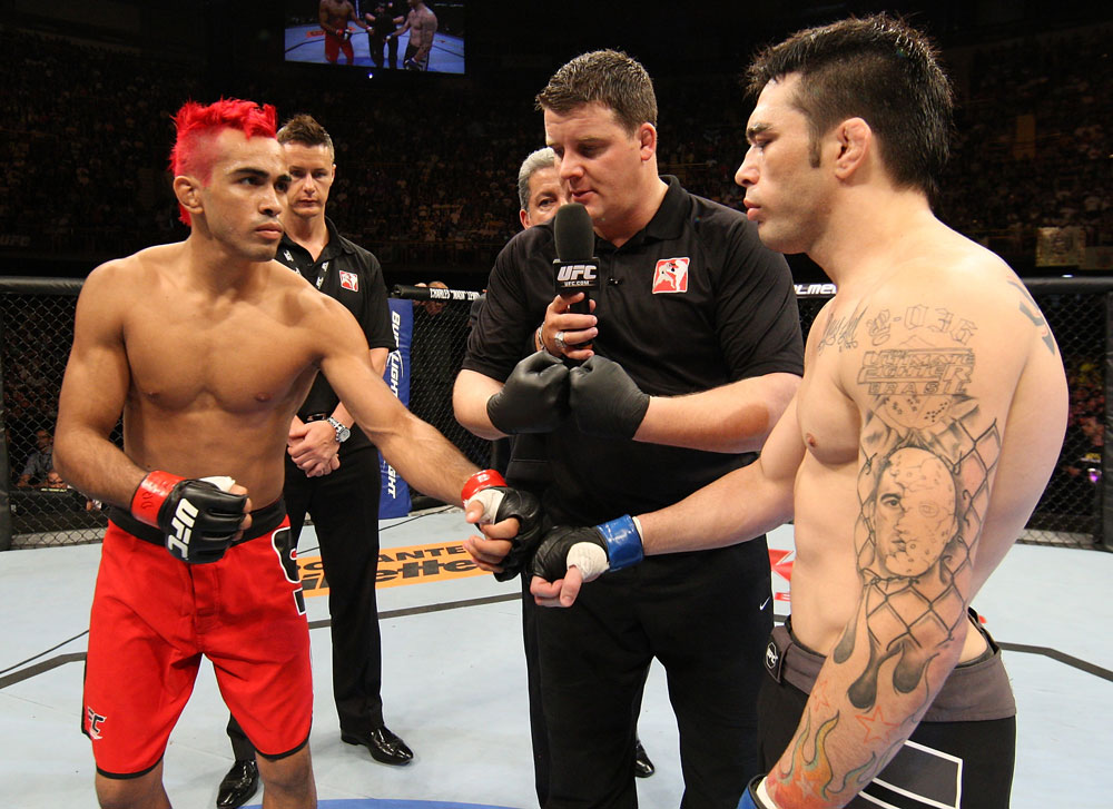BELO HORIZONTE, BRAZIL - JUNE 23: (L-R) Opponents Godofredo Pepey and Rony "Jason" Mariano Bezerra receive final instructions from the referee before their UFC 147 featherweight bout at Estadio Jornalista Felipe Drummond on June 23, 2012 in Belo Horizonte, Brazil. (Photo by Josh Hedges/Zuffa LLC/Zuffa LLC via Getty Images)