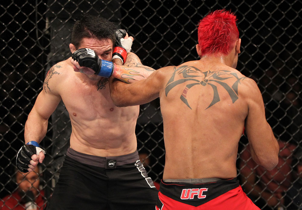 BELO HORIZONTE, BRAZIL - JUNE 23: (R-L) Godofredo Pepey and Rony "Jason" Mariano Bezerra trade punhces during their UFC 147 featherweight bout at Estadio Jornalista Felipe Drummond on June 23, 2012 in Belo Horizonte, Brazil. (Photo by Josh Hedges/Zuffa LLC/Zuffa LLC via Getty Images)