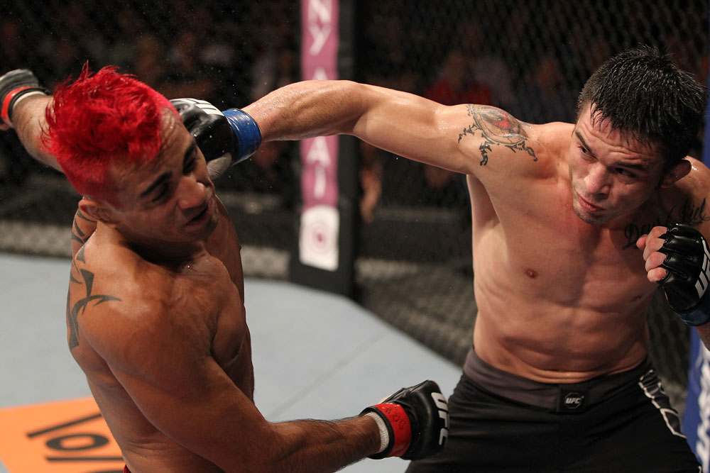 BELO HORIZONTE, BRAZIL - JUNE 23: (R-L) Rony "Jason" Mariano Bezerra punches Godofredo Pepey during their UFC 147 featherweight bout at Estadio Jornalista Felipe Drummond on June 23, 2012 in Belo Horizonte, Brazil. (Photo by Josh Hedges/Zuffa LLC/Zuffa LLC via Getty Images)