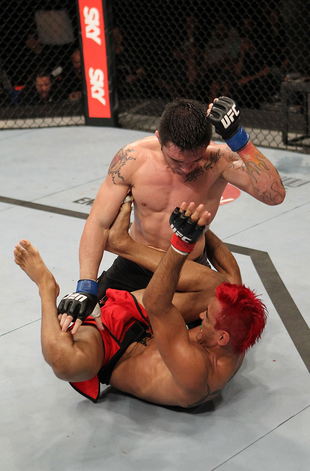 BELO HORIZONTE, BRAZIL - JUNE 23: Rony "Jason" Mariano Bezerra (top) punches Godofredo Pepey during their UFC 147 featherweight bout at Estadio Jornalista Felipe Drummond on June 23, 2012 in Belo Horizonte, Brazil. (Photo by Josh Hedges/Zuffa LLC/Zuffa LLC via Getty Images)