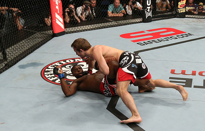 NOTTINGHAM, ENGLAND - SEPTEMBER 29: (R-L) Brad Pickett knocks out Yves Jabouin with a punch during their bantamweight fight at the UFC on Fuel TV event at Capital FM Arena on September 29, 2012 in Nottingham, England. (Photo by Josh Hedges/Zuffa LLC/Zuffa LLC via Getty Images)