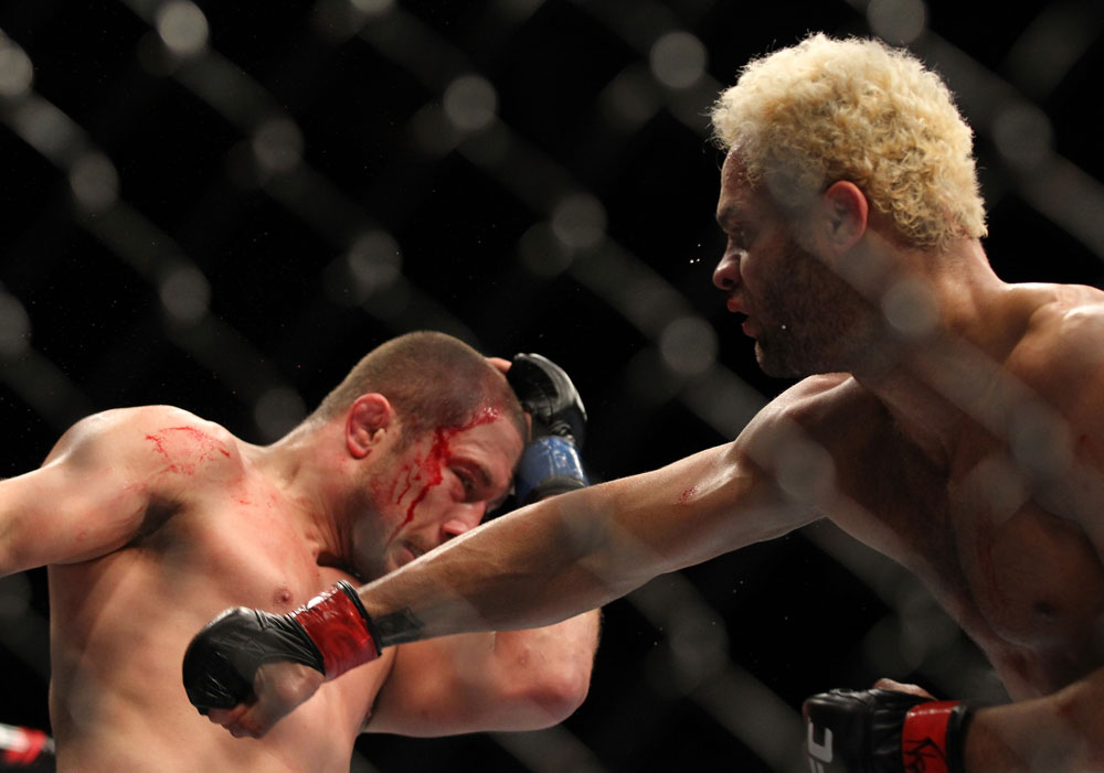 LAS VEGAS, NV - FEBRUARY 04:  Josh Koscheck (right) punches Mike Pierce during the UFC 143 event at Mandalay Bay Events Center on February 4, 2012 in Las Vegas, Nevada.  (Photo by Josh Hedges/Zuffa LLC/Zuffa LLC via Getty Images) *** Local Caption *** Josh Koscheck; Mike Pierce