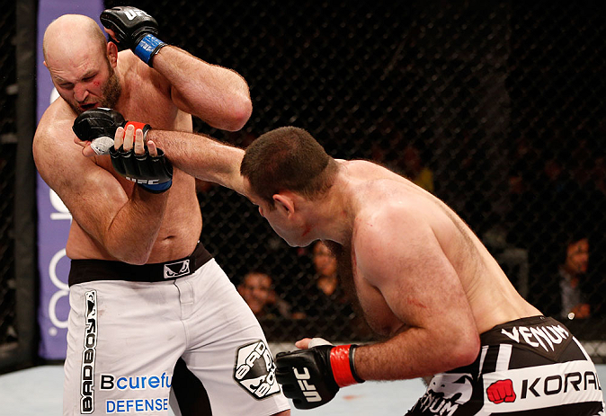 SAO PAULO, BRAZIL - JANUARY 19: (R-L) Gabriel Gonzaga punches Ben Rothwell in their heavyweight fight at the UFC on FX event on January 19, 2013 at Ibirapuera Gymnasium in Sao Paulo, Brazil. (Photo by Josh Hedges/Zuffa LLC/Zuffa LLC via Getty Images)
