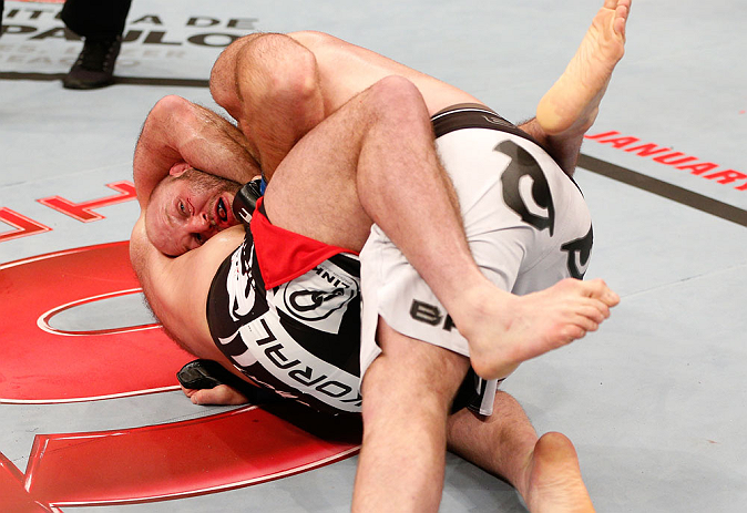 SAO PAULO, BRAZIL - JANUARY 19: (L-R) Gabriel Gonzaga secures a guillotine choke submission against Ben Rothwell in their heavyweight fight at the UFC on FX event on January 19, 2013 at Ibirapuera Gymnasium in Sao Paulo, Brazil. (Photo by Josh Hedges/Zuffa LLC/Zuffa LLC via Getty Images)