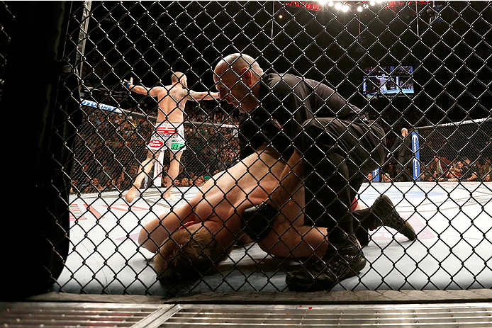 LAS VEGAS, NV - DECEMBER 28:  Travis Browne (rear) reacts to his victory over Josh Barnett in their heavyweight bout during the UFC 168 event at the MGM Grand Garden Arena on December 28, 2013 in Las Vegas, Nevada. (Photo by Josh Hedges/Zuffa LLC/Zuffa LLC via Getty Images) *** Local Caption *** Josh Barnett; Travis Browne